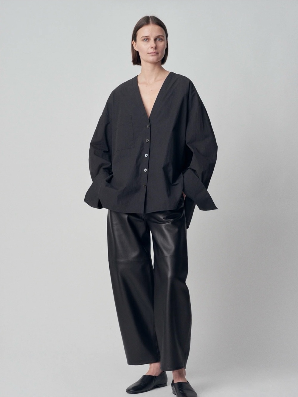 CO BACK PLEAT BLOUSE IN BLACK COTTON SIZE M .